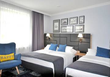 Фото номера Семейный номер Апарт-отели Hotel Włoski Boutique Centrum Poznań г. Познань 2