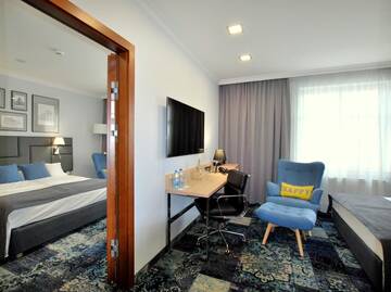 Фото номера Семейный номер Апарт-отели Hotel Włoski Boutique Centrum Poznań г. Познань 4